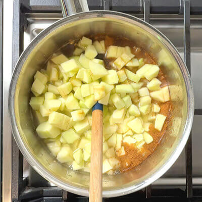 Step 2 - Then add water, or milk if you prefer. Also add the peeled and chopped apples, dried cherries, cinnamon and salt. Simmer until done.
