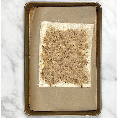 Step 3 - Sprinkle with pecan-bread crumb mixture over the butter. Leave about 1/2 inch border. Cover with phyllo sheet and brush with melted butter.