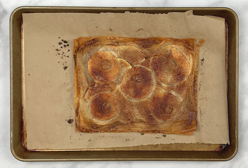 Step 6 - Bake Apple Pecan Phyllo Crisp in oven for approx. 30 minutes, rotate baking sheet half way through. When baked, the phyllo dough will be golden brown and apple will be soft. Keep an eye on this crisp, you don't want the edges of the dough to burn.