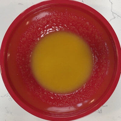 Step 2 - Mix in vanilla extract and the egg yolk.