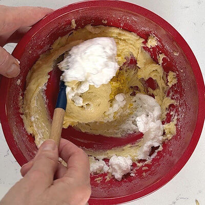 Step 5 - Whip the egg white stiff and fold it into the batter, together with the lemon zest.