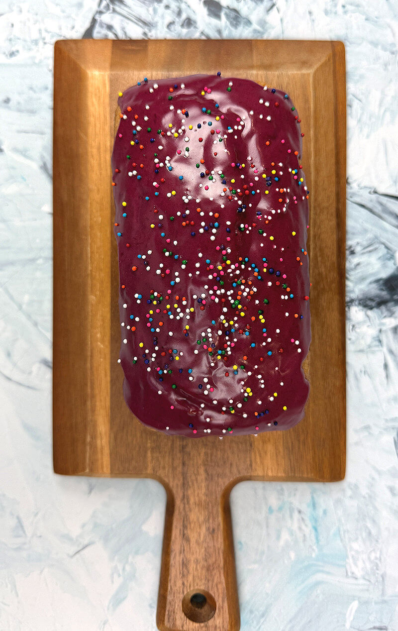 A top down view of the Blueberry Glazed Lemon Yogurt cake decorated with sprinkles.