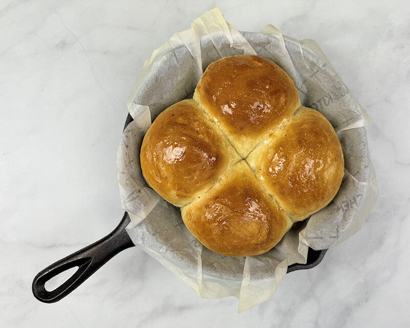 Step 6 - Remove from oven and brush with melted butter for a perfect shine.