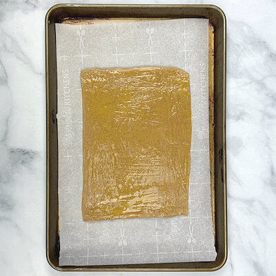 Step 4 - Roll the dough into a rectangle of 6 x 9, thickness about 1/8-inch. Brush dough with a whisked egg yolk.