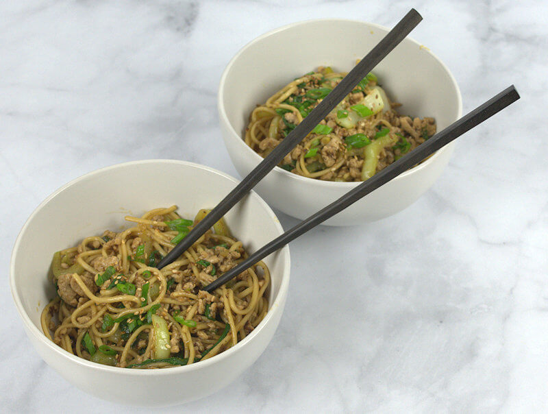 Two bowls of Stir-Fried Udon Noodles with Bok Choy