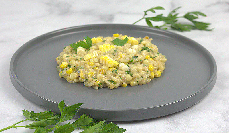 Grey plate with Fresh corn risotto