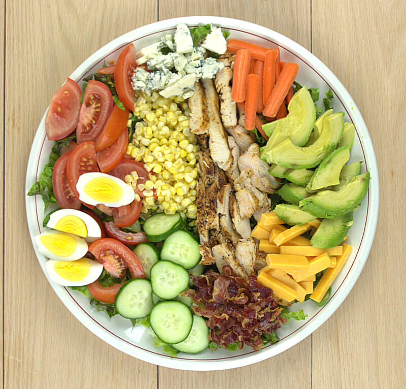Cobb Salad with all ingredients on a large plate
