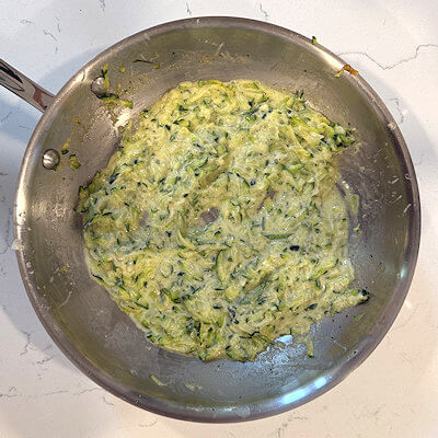 Step 3 - Add cream, Parmesan cheese and mix.