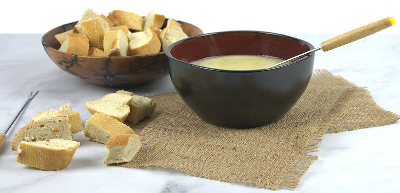 Cheese fondue pot with bread