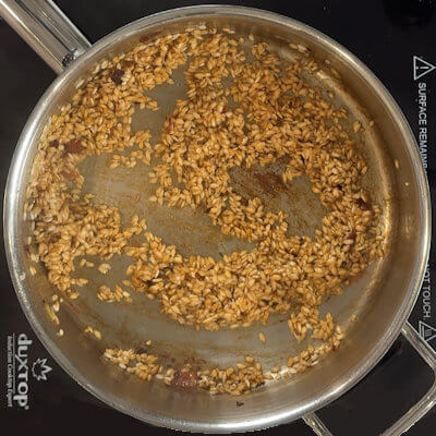 Step 3 - Add the white wine and stir until all the wine is absorbed by the rice.