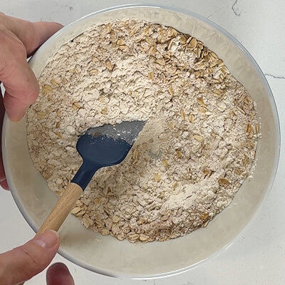 Step 2 - In a medium bowl, mix all-purpose flour, old fashioned rolled oats, baking soda, and salt.