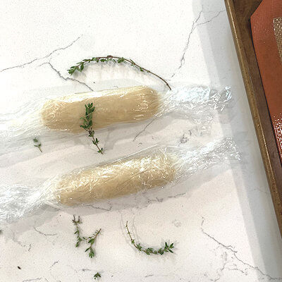 Step 1 - Mix the ingredients, by using a food processor, a pastry cutter or just your hands. Roll the dough into a log, wrap in plastic wrap and place the log in the fridge.
