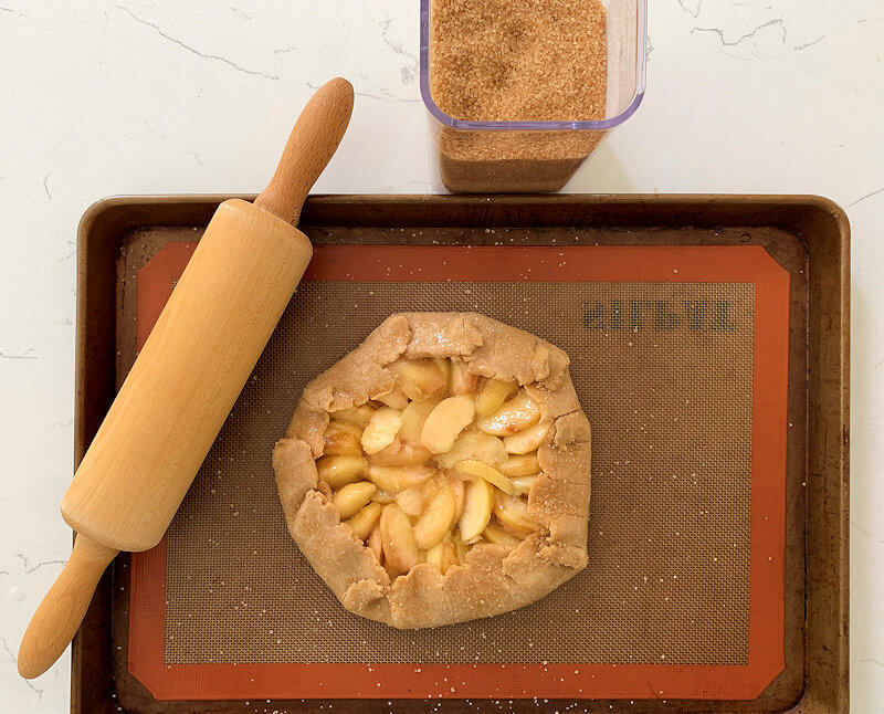 Whole wheat peach galette ready to go into the oven