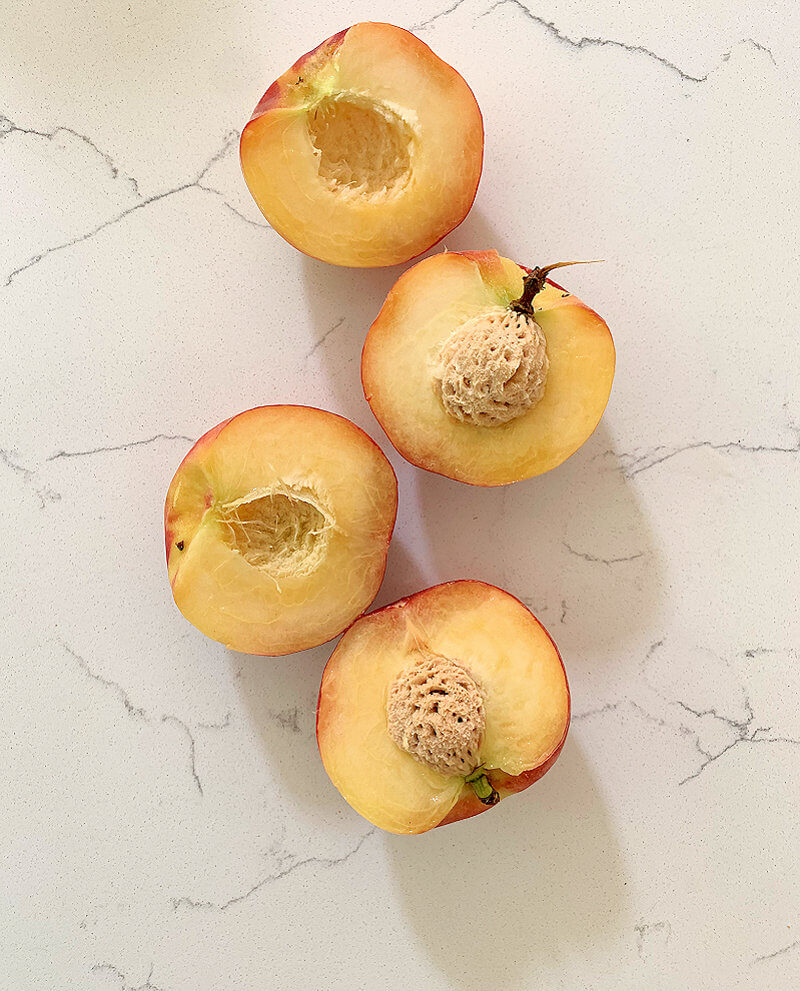 White peach halves, with and without pit