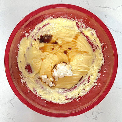 Step 3 - Beat in the yogurt and the vanilla extract.