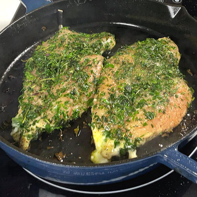 Step 1 - Rub the chicken breast with salt & pepper and then cover with fresh herbs. Add olive oil to a skillet and cook chicken breast on both sides, 2-3 minutes each.