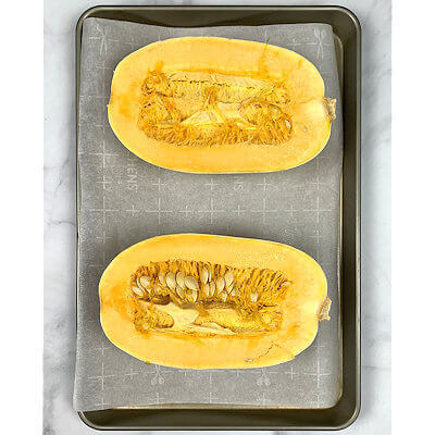 Step 1A - Cut the spaghetti squash. You can do this lengthwise.