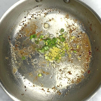 Step 3 - In same skillet, add scallion and ginger to the same skillet and cook until translucent.