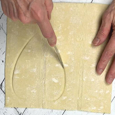 Step 1 - Roll out a 1/2 sheet of pastry dough and cut a heart shape. For this recipe I used a heart pie dish (6 x 5 inches). Place on baking sheet, lined with parchment paper.