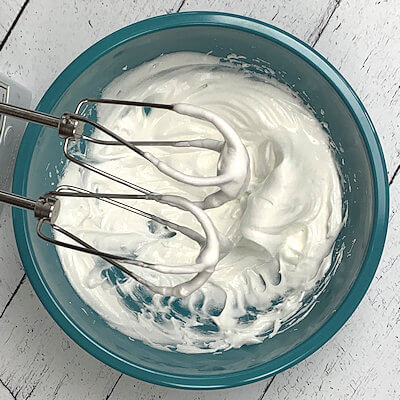 Step 3 - Whip the egg white with the cream of tartar. Gradually add sugar and salt until the whipped egg white shows stiff peaks.