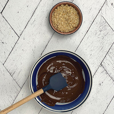 Step 4 - Melt the chocolate and finely chop the pine nuts.