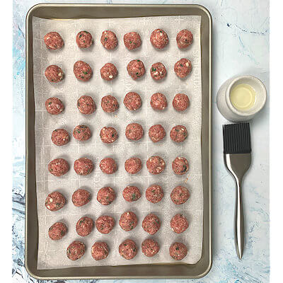Step 4 - Brush each meatball with a tiny bit of olive oil.