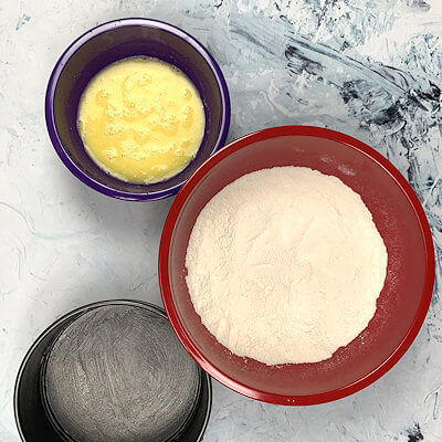 Step 1 - Butter a 6" springform (bottom and sides) or use parchment paper for the bottom and only butter the sides. Mix flour, sugar, baking powder and salt in one bowl. In another bowl, mix egg, butter, milk and vanilla.
