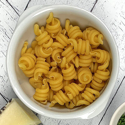 Step 2 - Cook the pasta according to the directions on the packaging. Drain and reserve some of the pasta water.