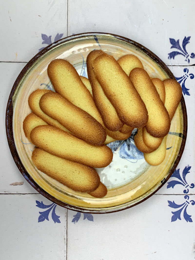 Langes de chat cookies on a dish.