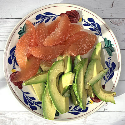 Step 2 - While the quinoa cooks, start prepping the vegetables; drain the chickpeas, chop the parsley and slice the avocado and grapefruit.
