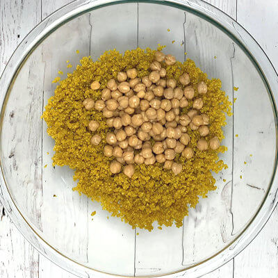 Step 3 - Once the quinoa is cooled a little and lovely and fluffy, add the chickpeas and toss the two together.