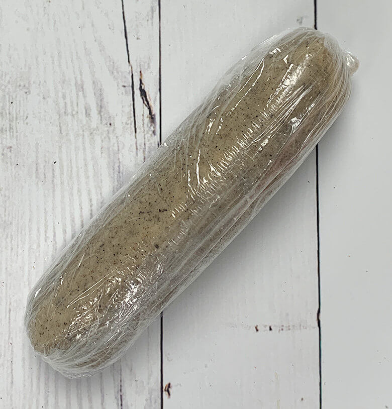 Dough rolled in plastic wrap to cool infridge