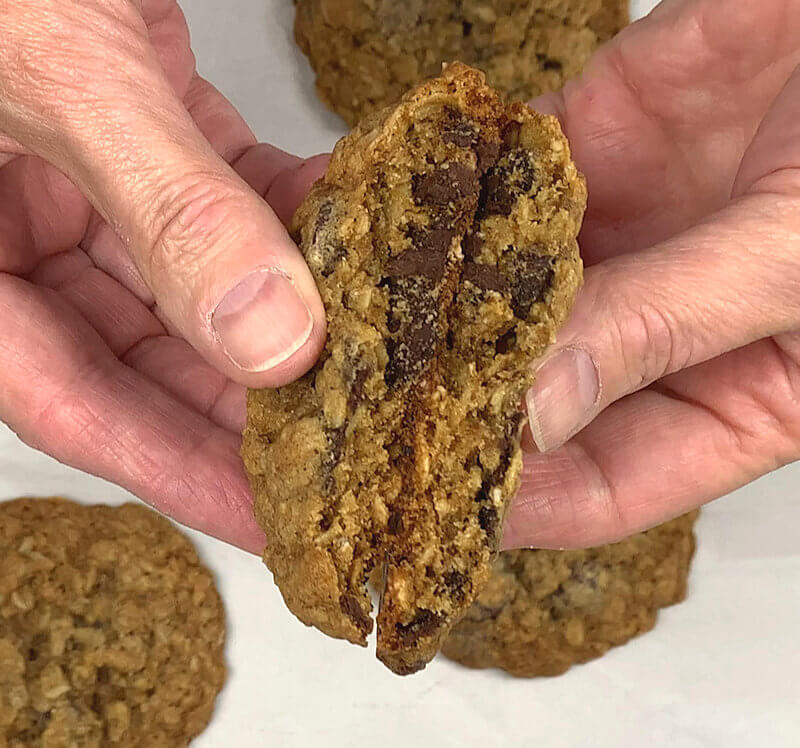 Oatmeal Chocolate Chip Cookies broken in half - a look inside.