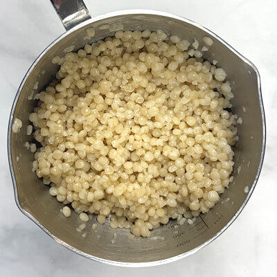 Step 1 - Cook the couscous according to the directions on the packaging and allow to cool a little.