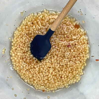 Step 2 - In a large bowl, mix all the ingredients for the vinaigrette; olive oil, maple syrup, apple cider vinegar, jalapeno jelly, lemon juice, salt & pepper.