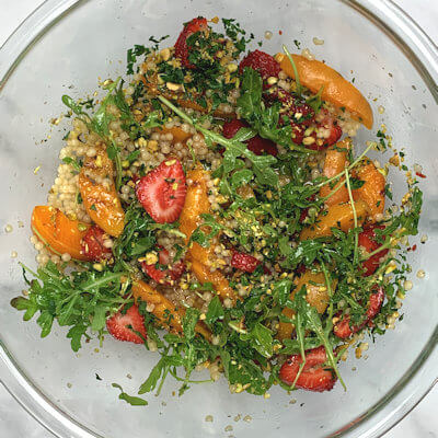 Step 5 - Add finely chopped parsley and pistachios to the couscous, and mix well but carefully, as you want to keep the apricot slices whole.