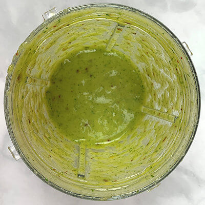 Step 2 - Make the pineapple sauce. This is a simple step. Transfer pineapple, cilantro, lime zest, lime juice, olive oil, pepper flakes, salt & pepper to a blender and blend until you have a smooth sauce.