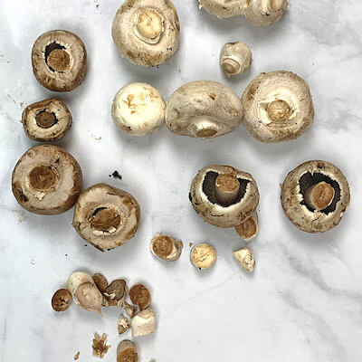 Step 1 - Cut the stems off the mushrooms.