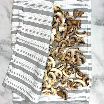 Step 4 - If your recipe calls for sliced mushrooms, do so now and dry the slices again.