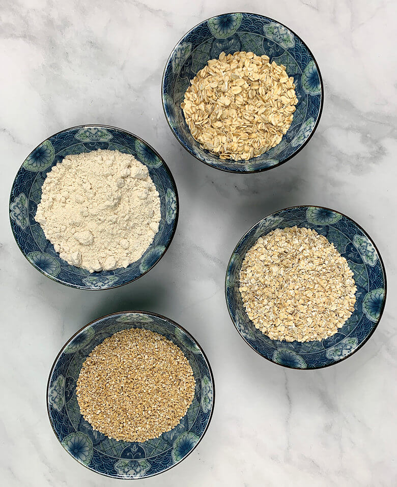 4 bowls with different types of oat varieties