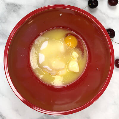 Step 2 - Whisk melted butter, sugar, egg, yogurt and vanilla extract until well combined.
