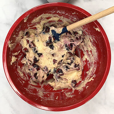 Step 4 - Heat the oven to 375°F.Wash, dry, pit and chop the cherries.Fold the cherries into the batter.