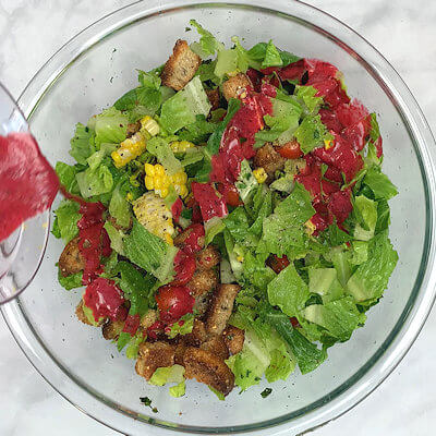 Step 5 - Pour dressing over the salad and mix.