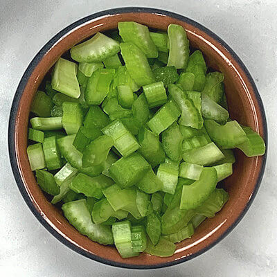 Step 3 - In the meantime, add a tablespoon of olive oil to a skillet and add the chopped celery. Cook for about 5 minutes.