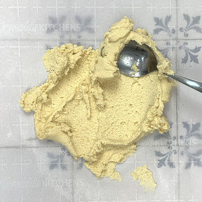 Step 2 - This step is optional. Place the dough on parchment paper or on your clean counter and 'rub/spread' the dough with a spatula, bowl scraper or spoon.