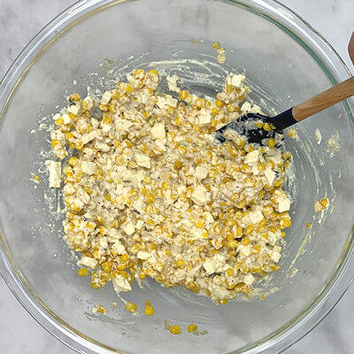 Step 2 - Transfer ricotta, Boursin and finely chopped or shredded Mozzarella into a bowl and mix. Add the cooled corn-onion mixture and thyme and mix again. Add salt and pepper to taste.