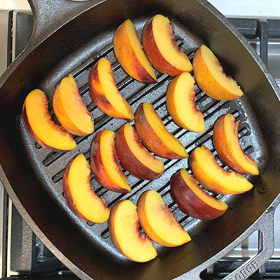 Step 3 - Heat the grill or a grill pan and place the peach slices on the grill for 4-5 minutes or until you see grill marks.