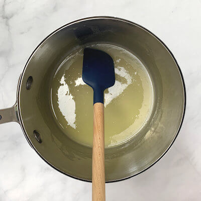 Step 1 - Bring water, butter and sugar to a boil. Allow the butter to melt and the sugar to dissolve.