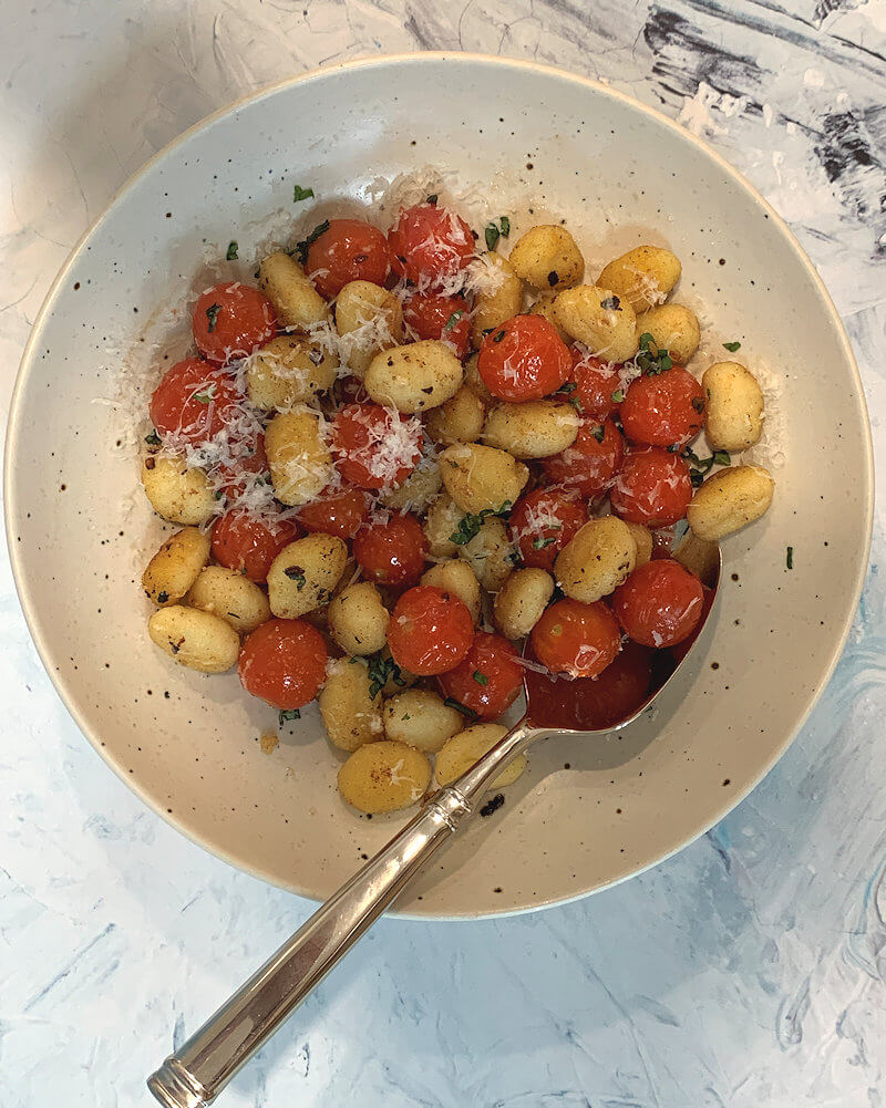 Tomato Basil Gnocchi in bowl with fork.