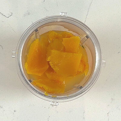 Step 5 - While the first addition of broth is being absorbed by the rice, make the butternut squash puree. Scoop the flesh out of the cooked squash add it into a blender of food processor. Add the remaining broth and process until you have a smooth mixture.